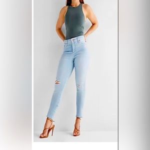 Express Curvy Mid Rise Light Wash Ripped Jeans